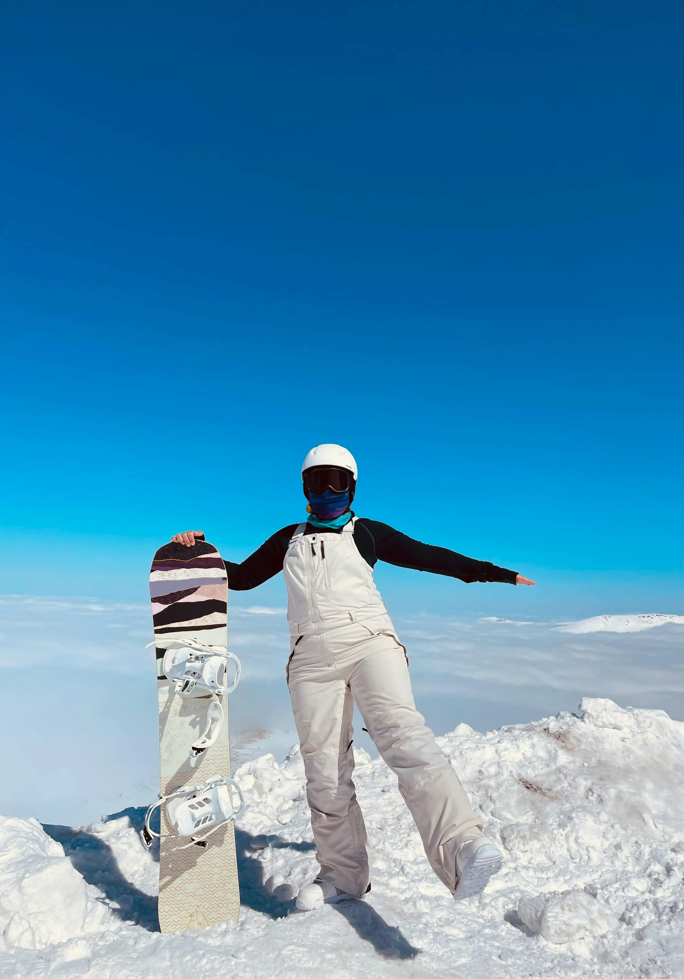 person skiing down fresh powder mountain slope